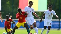 Timnas Indonesia U-23 Vs Timnas Guinea U-23. (Bola.com/Dok.AFP/MIGUEL MEDINA).